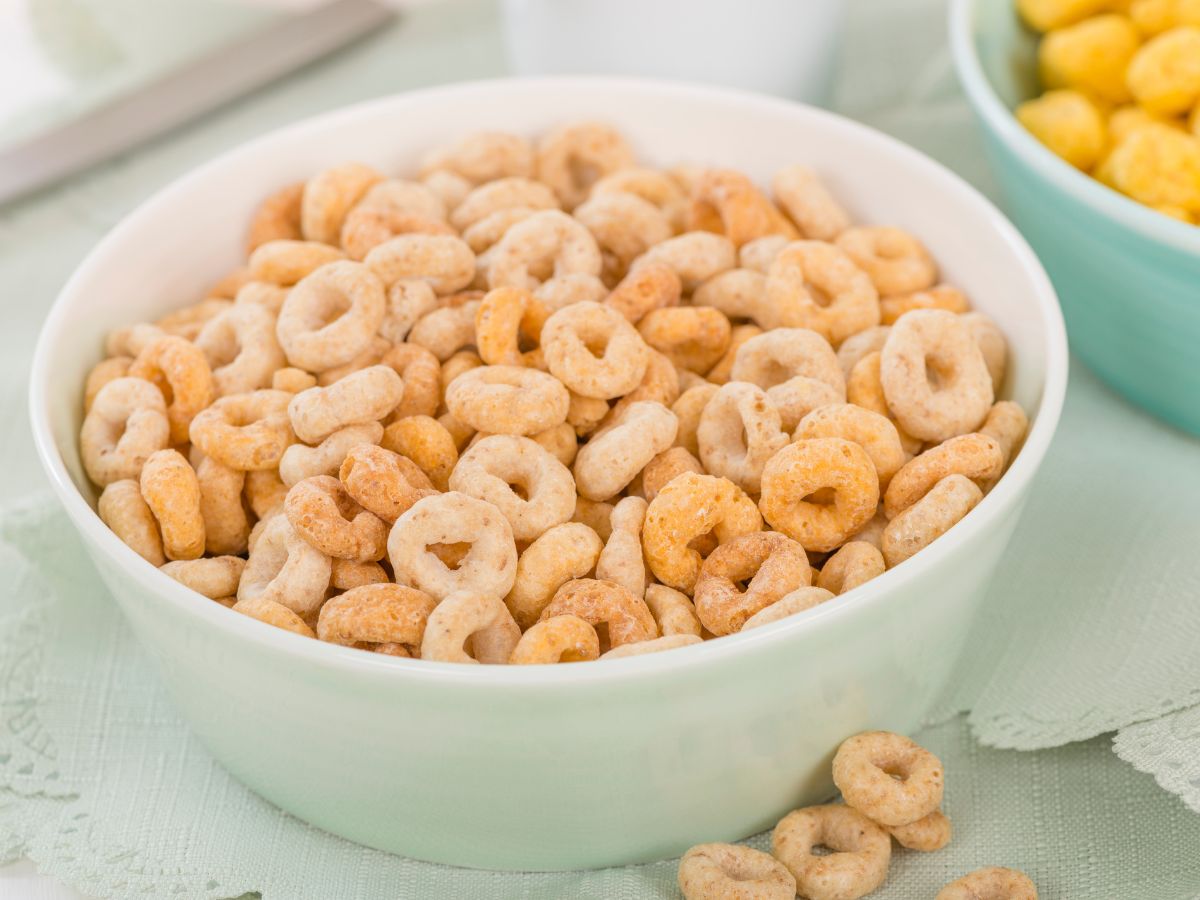 A bowl full of cheerios on a table.