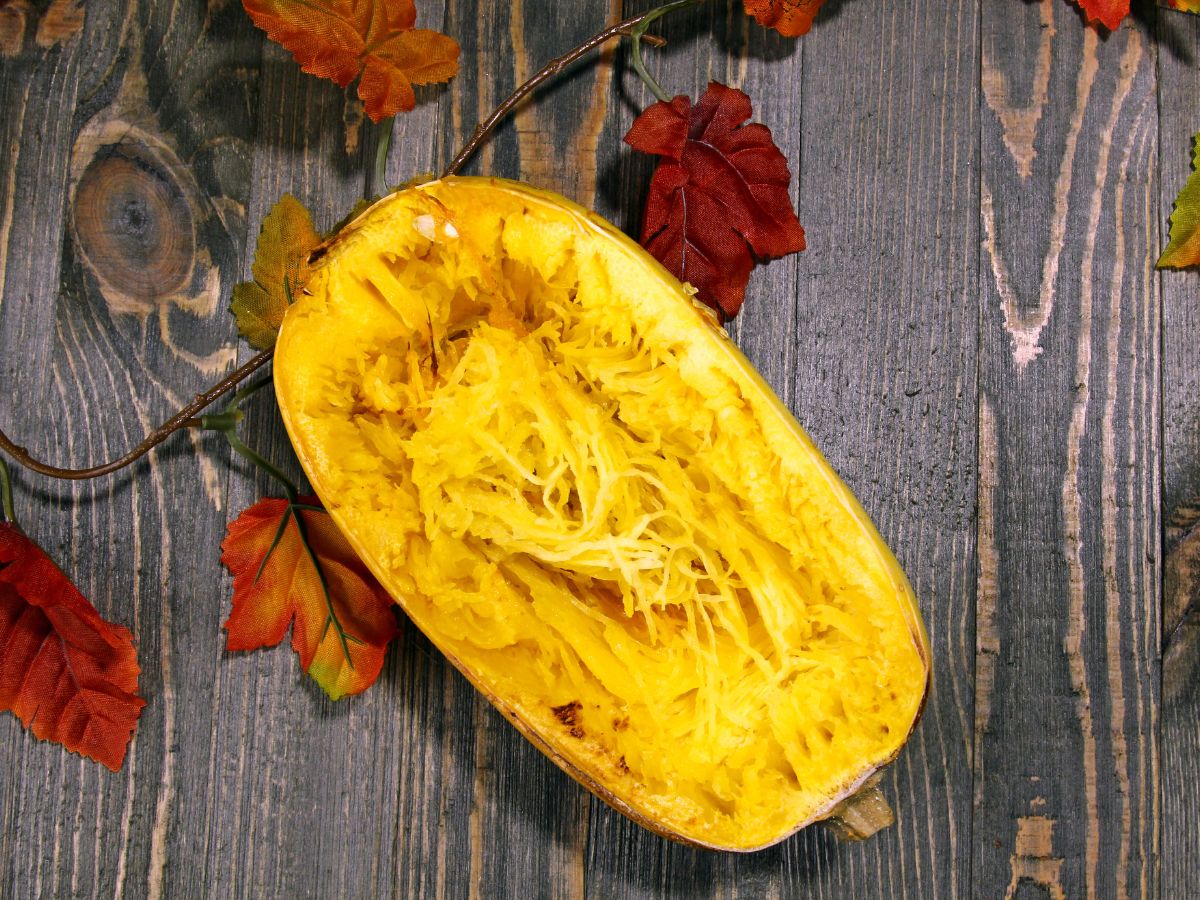 Half of the spaghetti squash on a wooden table.
