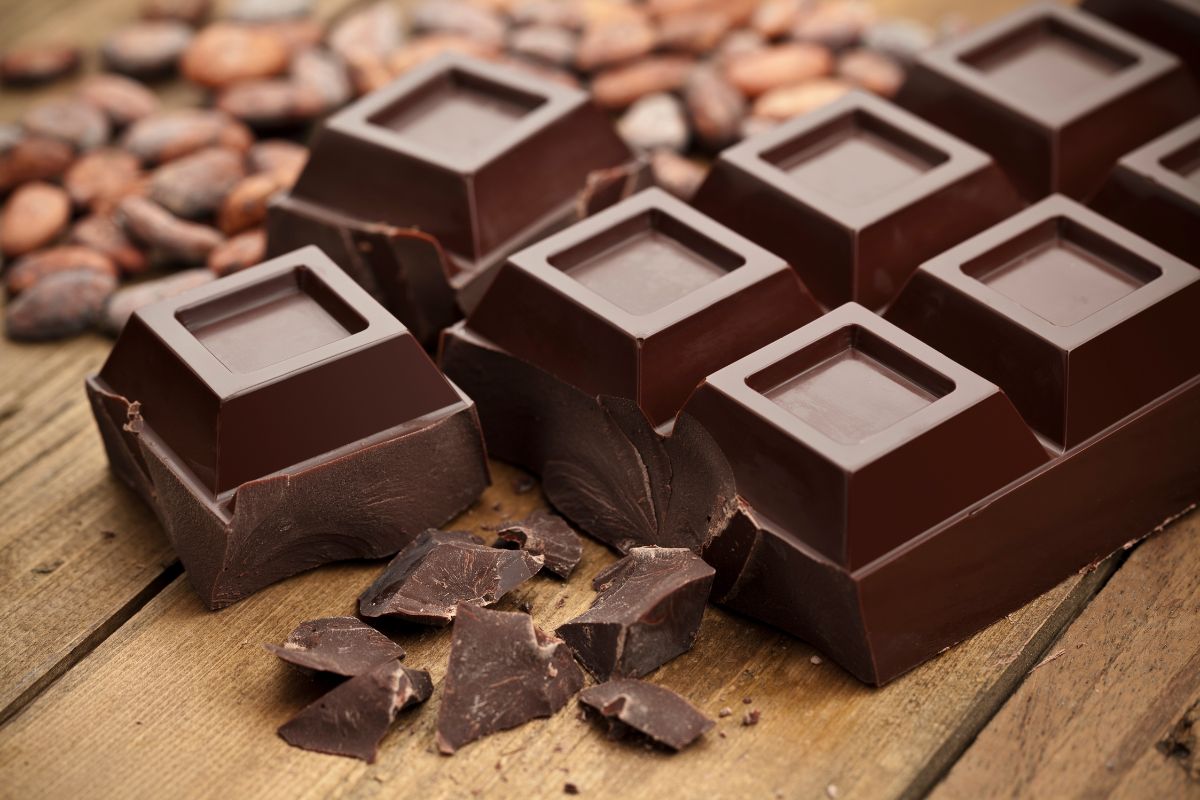 A chocolate bar on a wooden table.