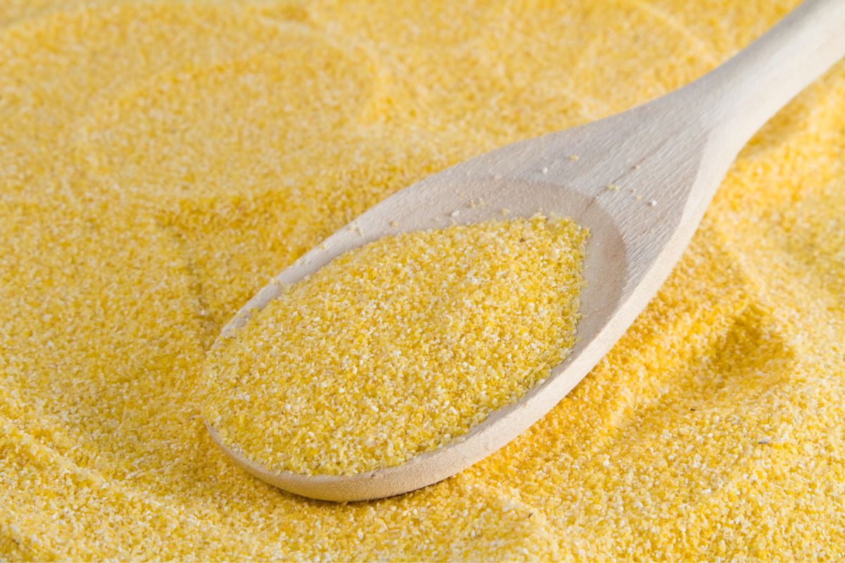Cornmeal with a wooden spoon.