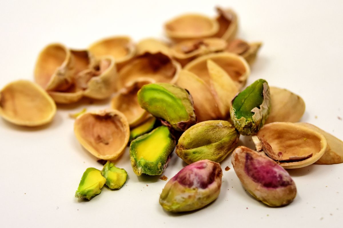 Peeled pistachios and pistachios shells.